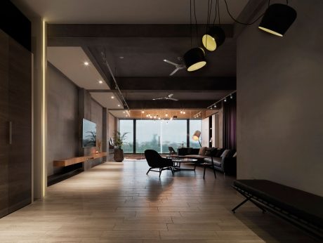 Spacious modern living area with sleek furniture, lighting, and large windows overlooking the outdoors.