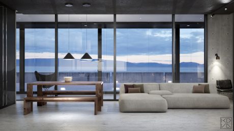 Expansive floor-to-ceiling windows frame sweeping mountain views in this contemporary, minimalist space.