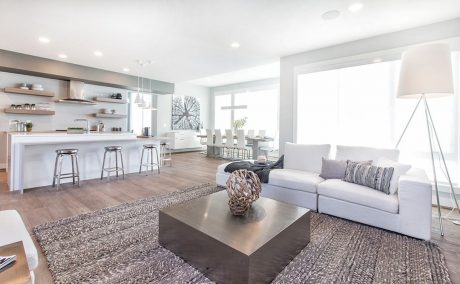 Bright, spacious open-concept living area with modern kitchen, dining, and lounge spaces.