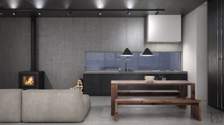 Minimalist concrete kitchen with wood table, fireplace, and modern lighting fixtures.