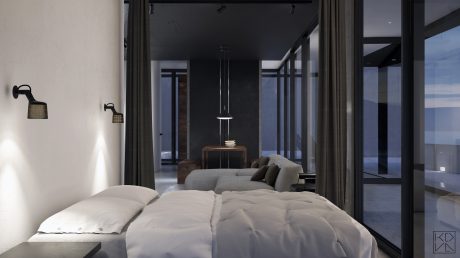 Minimalist bedroom with large windows offering panoramic mountain views and sleek modern furnishings.