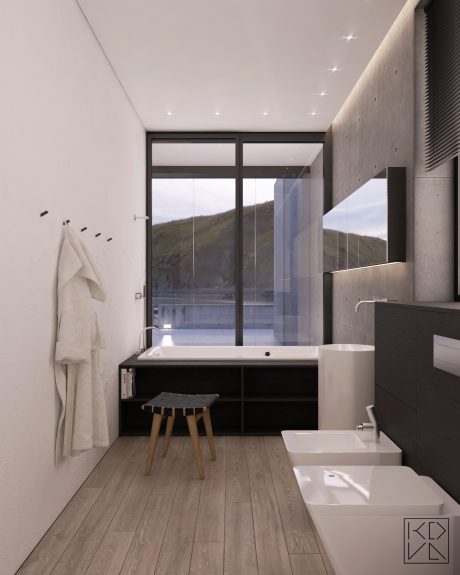 Modern minimalist bathroom with large windows showcasing scenic mountain view.