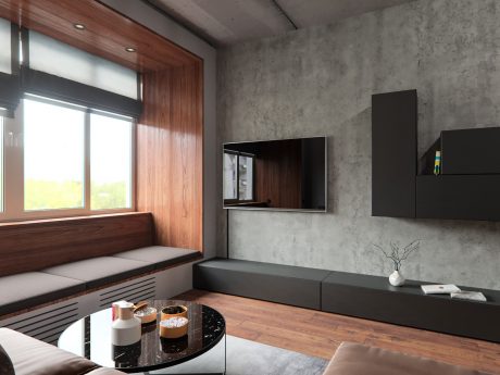 Minimalist living room with wood, concrete, and black furniture accents. Cozy window nook.