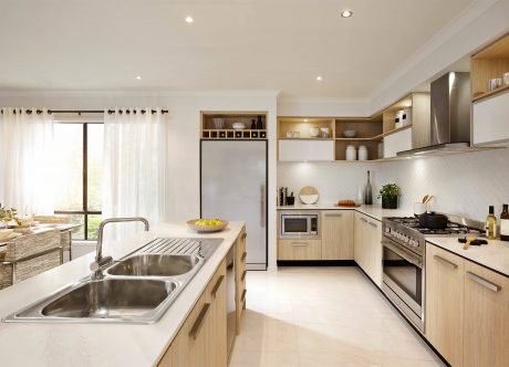 Modern, spacious kitchen with wooden cabinetry, stainless steel appliances, and ample counter space.