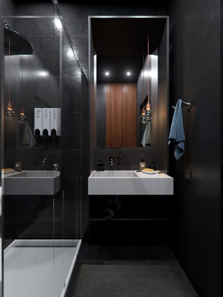A contemporary bathroom with dark walls, recessed lighting, and a wooden vanity.
