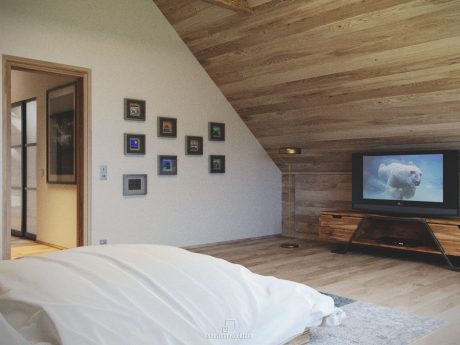 Rustic wooden ceiling, wall art, and television in a cozy bedroom space.