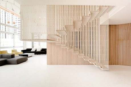 Intricate wooden staircase architecture with minimalist interior design elements.