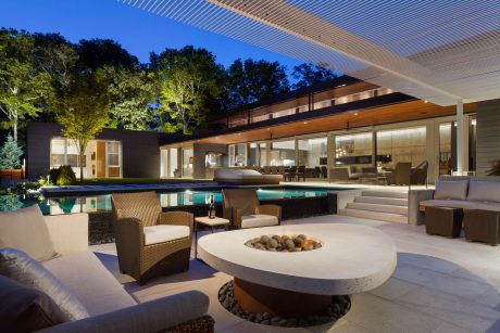 Stunning modern house with pool, outdoor lounge, and striking architectural features.