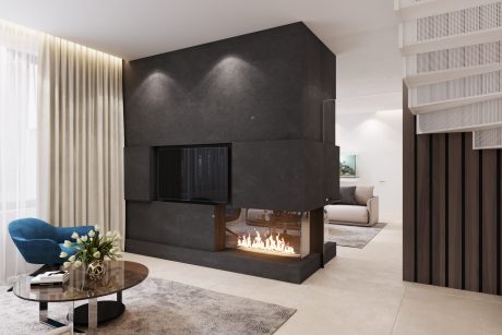 A modern, minimalist living room with an impressive black fireplace feature.