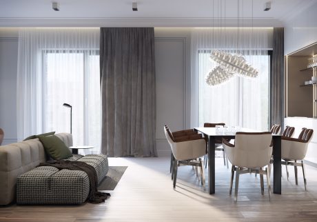 Elegant modern living space with sleek furnishings, pendant lighting, and ornate curtains.