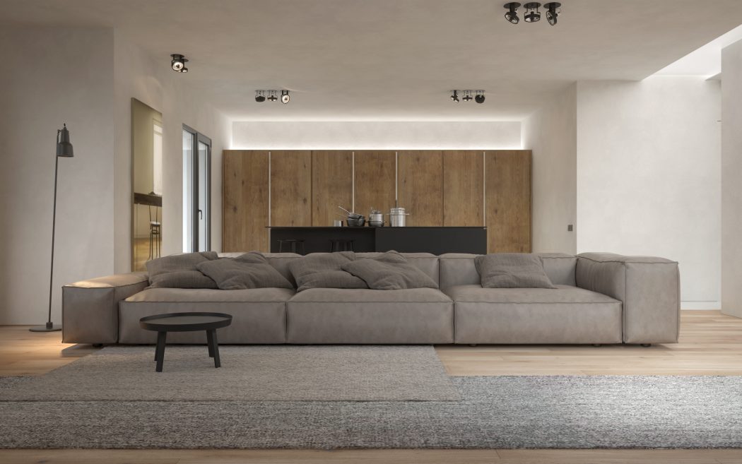 Spacious living area with large modular sofa, minimalist decor, and wood-paneled wall.