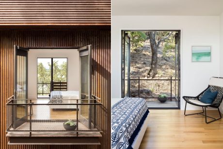 Striking wood-paneled walls, floor-to-ceiling windows framing natural scenery, and modern furnishings.
