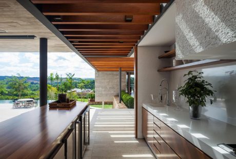 Spacious modern home with wooden ceiling beams, nature-inspired decor, and scenic views.