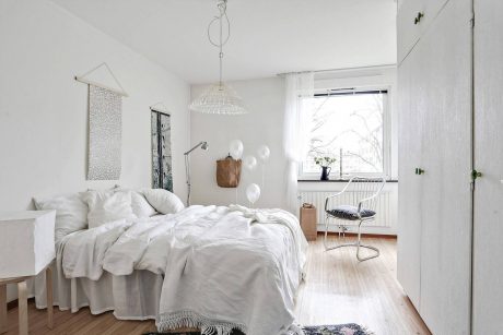 Serene, minimalist bedroom with a cozy, inviting atmosphere and tasteful decor elements.
