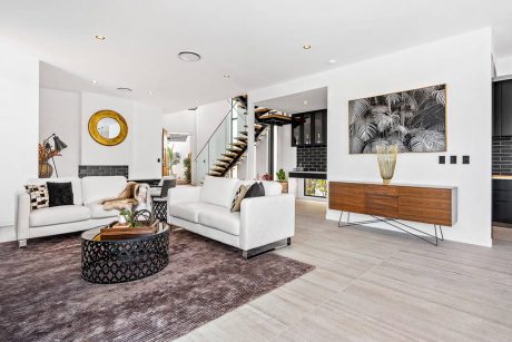 Sleek modern living room with minimalist furniture, wood accents, and geometric decor.