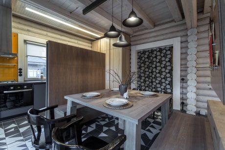 Cozy and rustic wooden cabin interior with modern accents and stylish furnishings.
