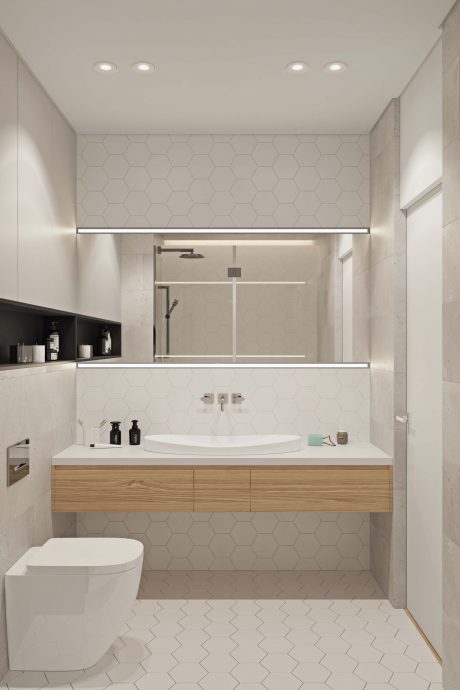 Minimalist bathroom design with hexagonal tile patterns, wooden vanity, and recessed lighting.