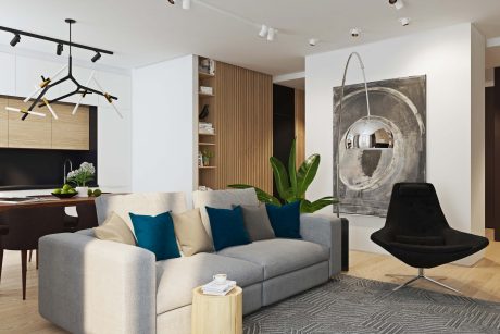 Minimalist living room with abstract art, sleek furniture, and natural lighting.