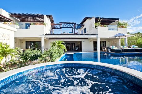 Stunning contemporary architecture with sleek pergola structures, pools, and lush landscaping.