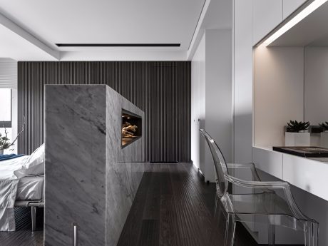 Sleek, modern interior featuring marble, wood, and glass accents, creating a chic, minimalist aesthetic.