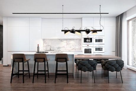 A modern open-concept kitchen with sleek white cabinets, a marble backsplash, and pendant lighting.