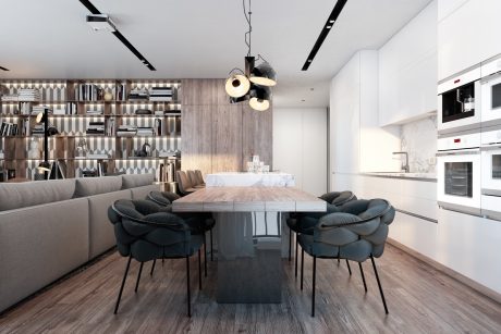 Sleek modern kitchen with built-in shelves, marble countertops, and plush dining chairs.