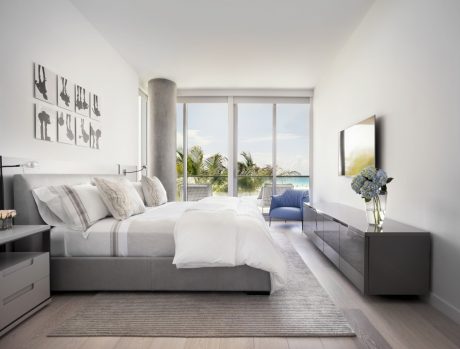 Spacious, well-lit bedroom with modern furniture, large windows overlooking a scenic view.