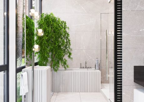 Elegant modern bathroom with lush greenery, sleek fixtures, and natural stone tiles.