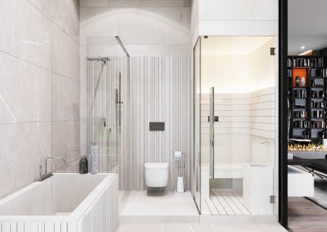 Spacious, modern bathroom with minimalist tiling, glass shower, and built-in shelving.