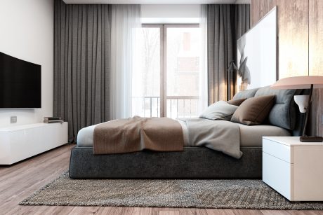 Spacious bedroom with modern wood paneling, large curtained windows, and minimalist furnishings.