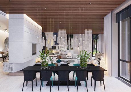 Contemporary dining room with sleek black furniture, geometric light fixtures, and lush greenery accents.