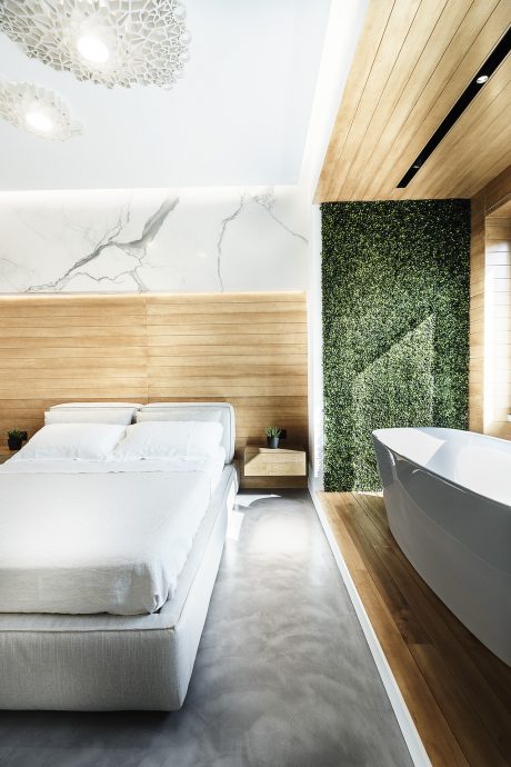 Sophisticated bedroom design featuring natural wood, marble, and greenery accents.