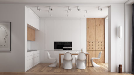 A modern, minimalist kitchen-dining space with sleek white cabinetry, wooden accents, and sculptural chairs.