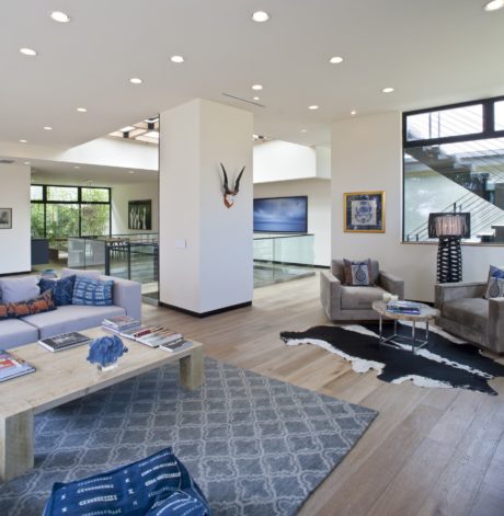 Expansive open-concept living area with modern furnishings, lighting, and architectural details.
