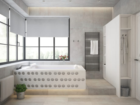 A modern, sleek bathroom design with a statement bathtub, large windows, and a towel warmer.