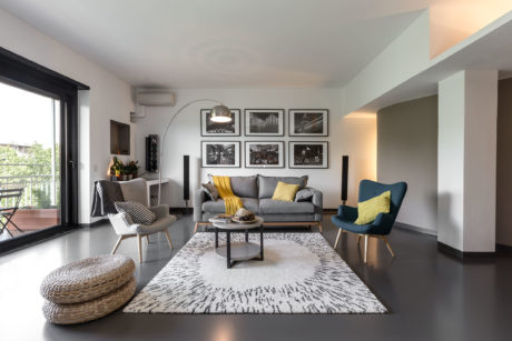 Sleek, modern living room with stylish furniture, artwork, and neutral color palette.