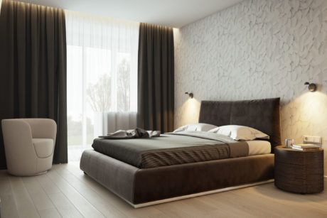Minimalist bedroom with textured accent wall, dark curtains, and modern furnishings.