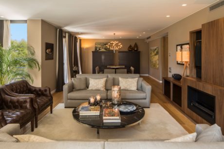 Elegant living room with modern furniture and warm lighting.