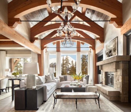 Rustic-chic living room with exposed beams and large windows.
