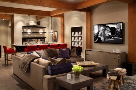 Cozy living room with modern furniture and wooden accents.