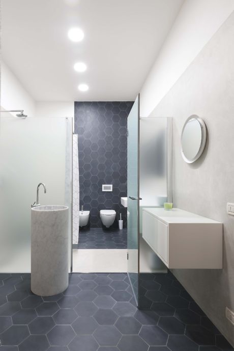 Modern bathroom with geometric tiles and sleek fixtures