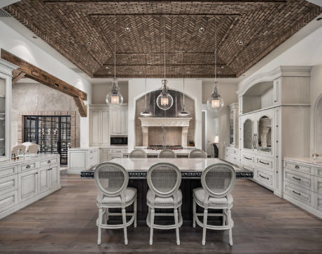 Elegant kitchen with textured ceiling, central island, and pendant lights.