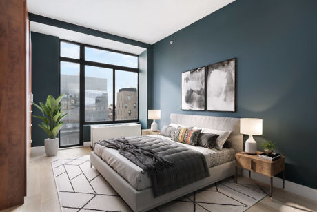 Contemporary bedroom with teal walls, large window, and city view.