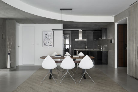 Contemporary dining area with minimalist design and neutral tones.