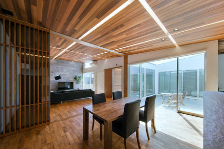 Contemporary interior with wooden slats ceiling and LED strips.
