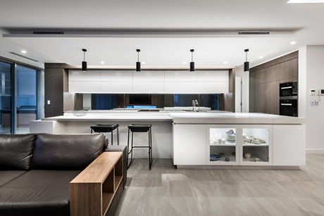 Sleek kitchen with island and integrated living space.