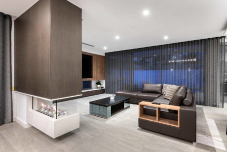 Contemporary living room with sleek fireplace and minimalist decor.