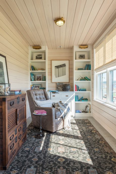 Cozy home office with built-in shelves and patterned floor.