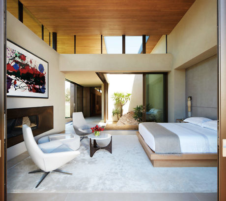 Contemporary bedroom with sleek furniture and wooden accents.