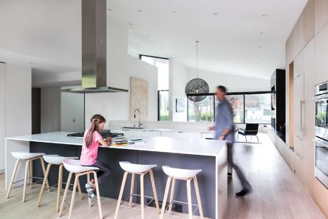 Sleek kitchen with island and minimalist decor.